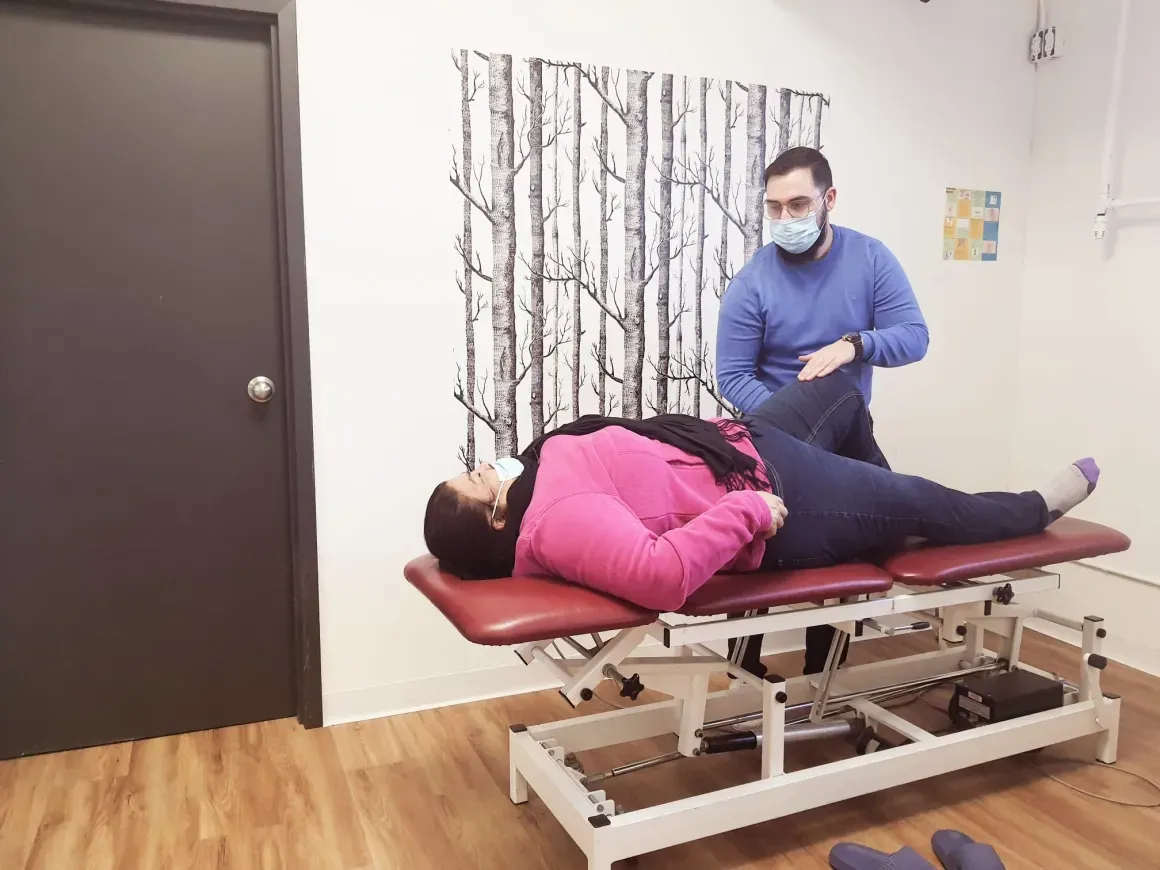 Physiotherapist treating a patient's hip